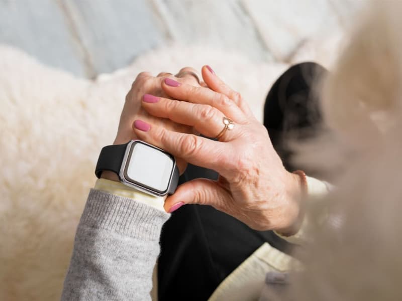 senior woman with smart watch featuring fall detection